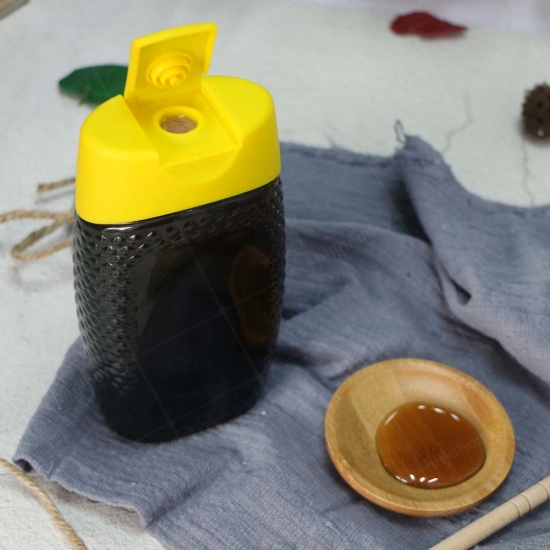 Bouteille avec couvercle en silicone, miel de sarrasin naturel pur 